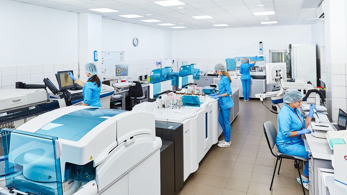 Controlled cell-manufacturing laboratory with automated analysers and gowned technicians — GMP stem-cell product characterisation, Panacea Bio Chem, Bogdan Dicoias